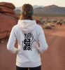 female hiker at nevada petroglyph site wearing hoodie with i love petro glyph logo